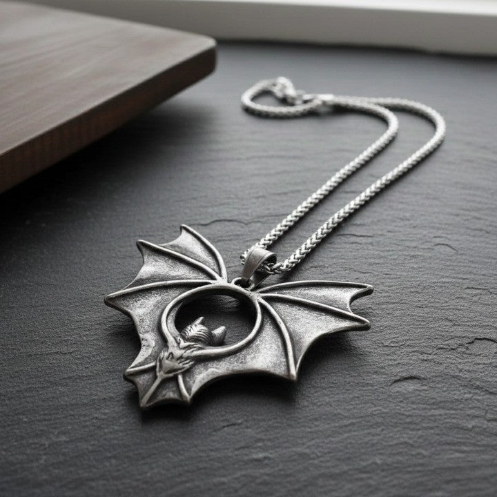 Gothic Night Bat Pendant Necklace hanging against a dark background
