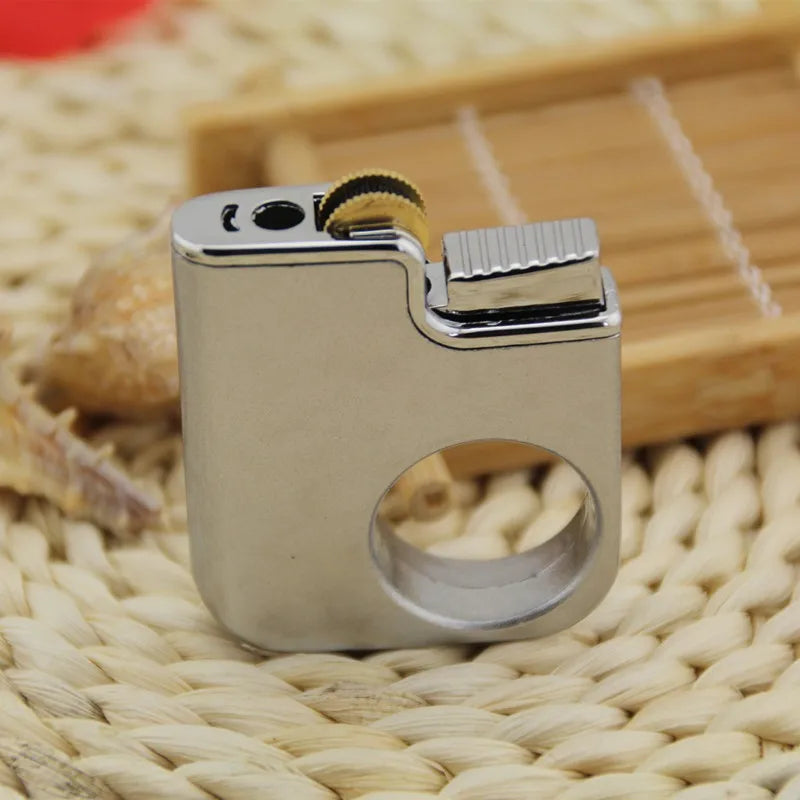 Close-up of the mini gas lighter's mechanical flint ignition