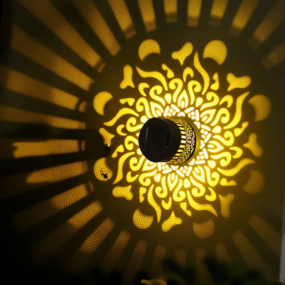 Geometric solar light casting beautiful patterns on a garden wall