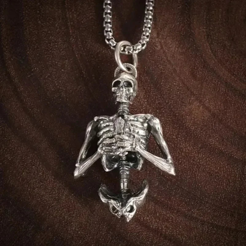 Detailed view of the silver skeleton pendant