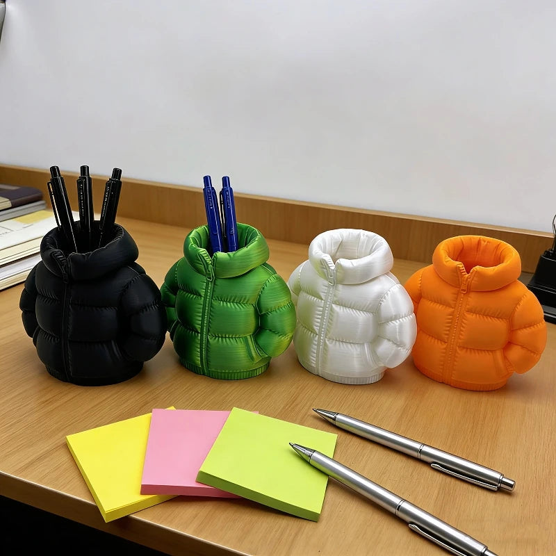 Pens and stationery organized in the Mini Puffer Jacket Pen Holder