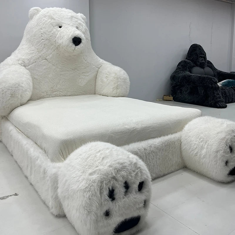 Full view of the Polar Bear Giant Plush Cozy Bed in a stylish room setting