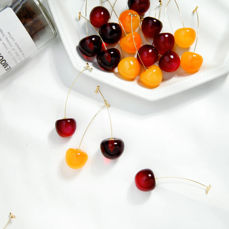 Model wearing the charming cherry earrings as a perfect lifestyle present