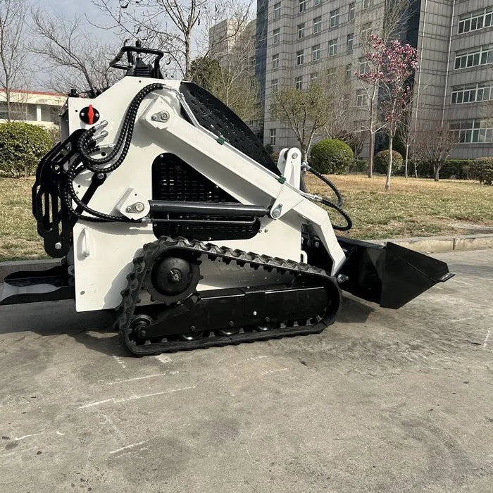 Compact All-Terrain Mini Loader shown in a tight space