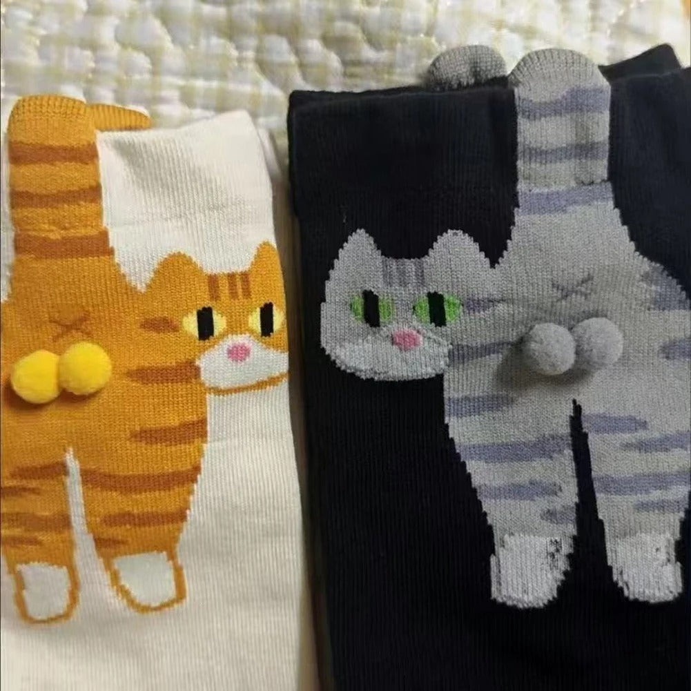 Someone comfortably wearing the quirky cat socks at home