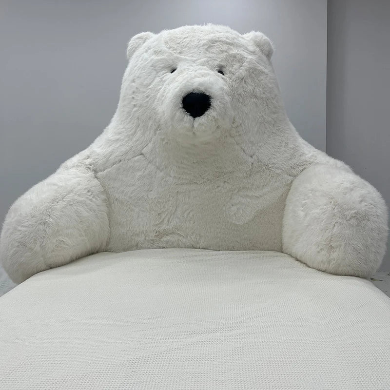 Close-up view of the plush white fabric of the polar bear bed