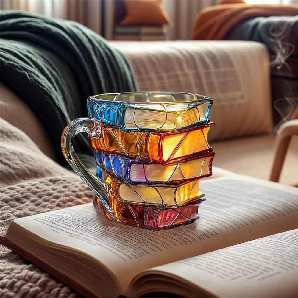 A person holding the Stacked Books Coffee Mug, showing its comfortable handle and size.