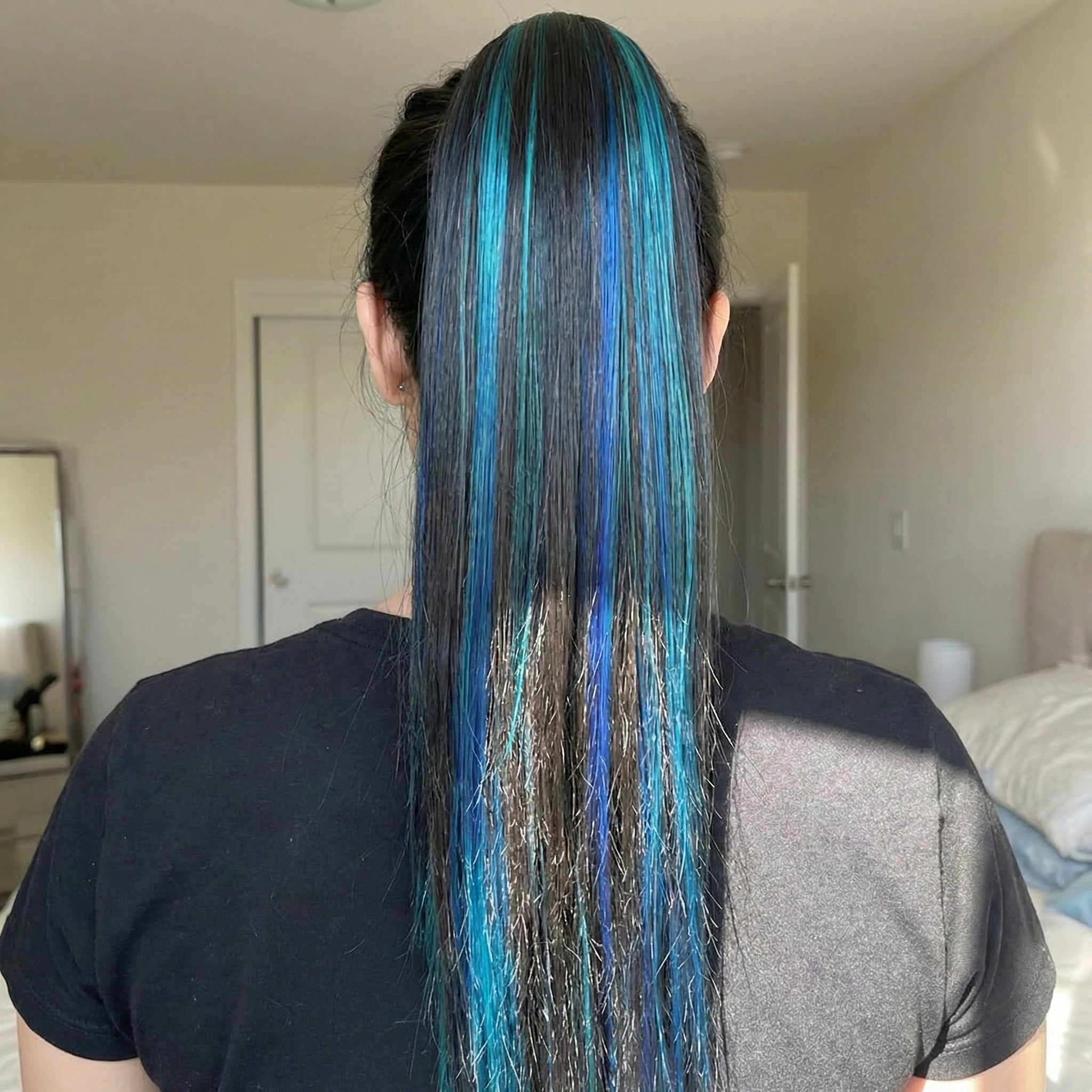 A woman showing the dramatic length of the Clip Claw Ponytail Hair Extension