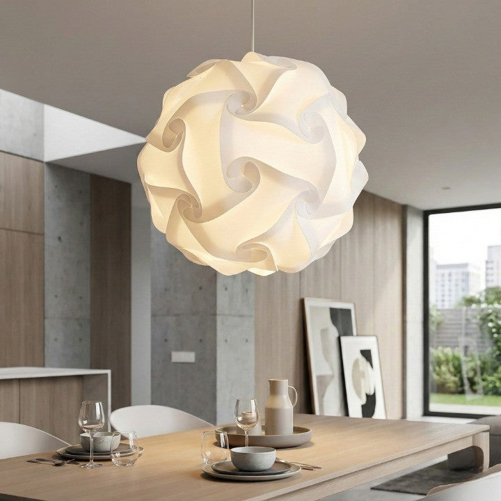 Close-up detail of the abstract ceiling light diffusing a warm glow