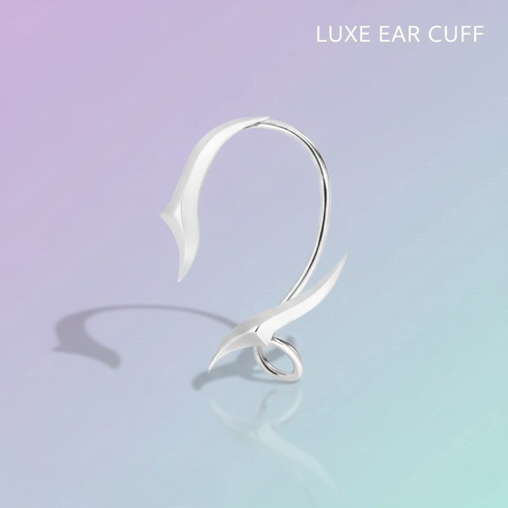 A model wearing the Night Arc Ear Cuff for an elegant evening look, highlighting its versatility.