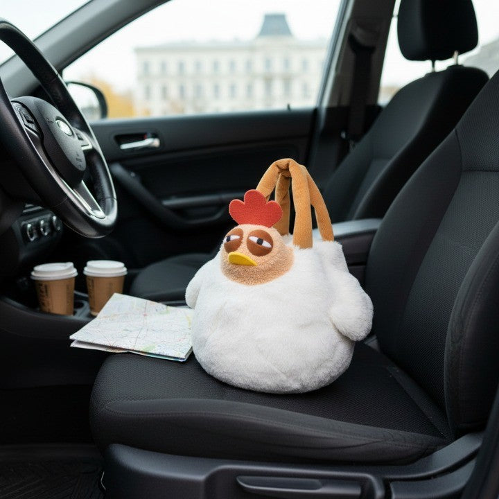 Close-up of the sleepy-eyed expression on the plush chicken bag