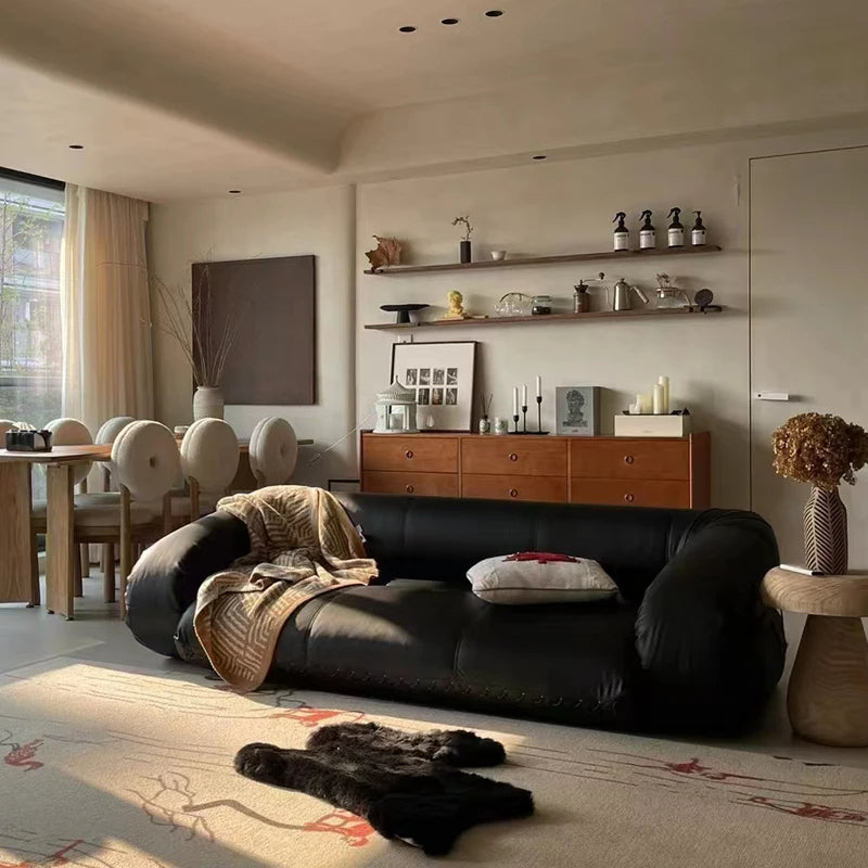 Elegant leather sofa bed shown in a comfortable home environment