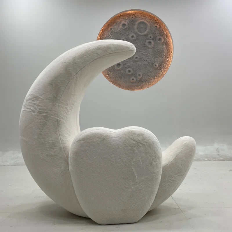 The moon-shaped chair in a cozy bedroom setting