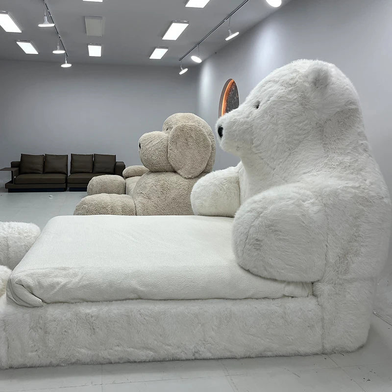 A child happily playing on the Polar Bear Giant Plush Cozy Bed
