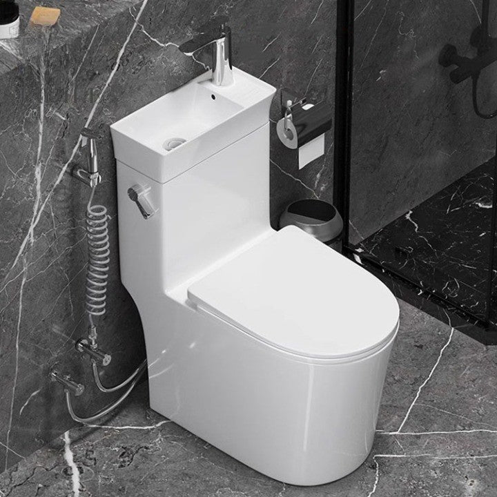 Close-up view of the integrated sink and faucet on the toilet
