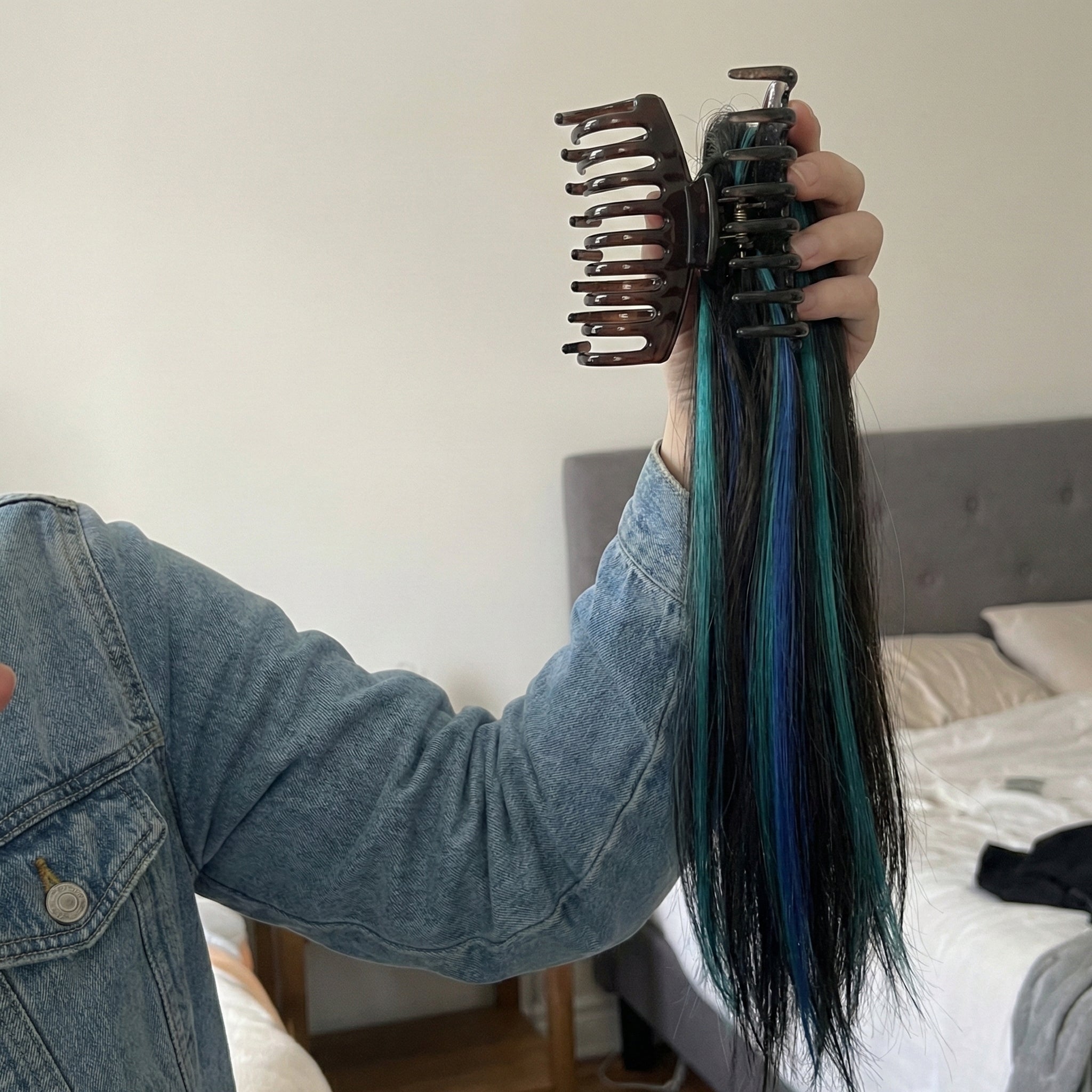 Woman showcasing the full and voluminous look of the ponytail extension from the side