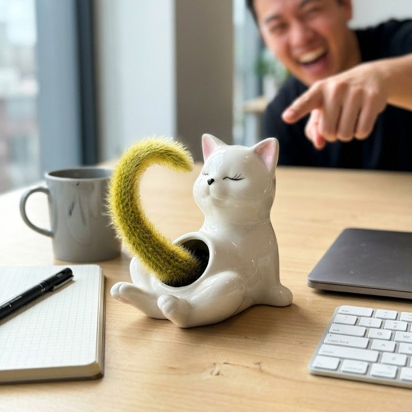 Quirky cat planter holding a succulent in a stylish home