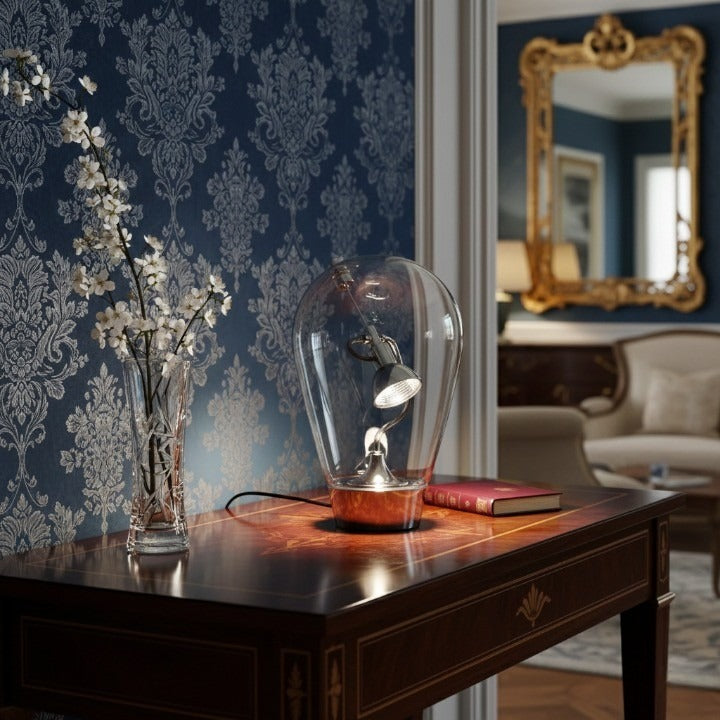 Glass Halo Sculptural Table Lamp as a decorative home essential on a shelf.