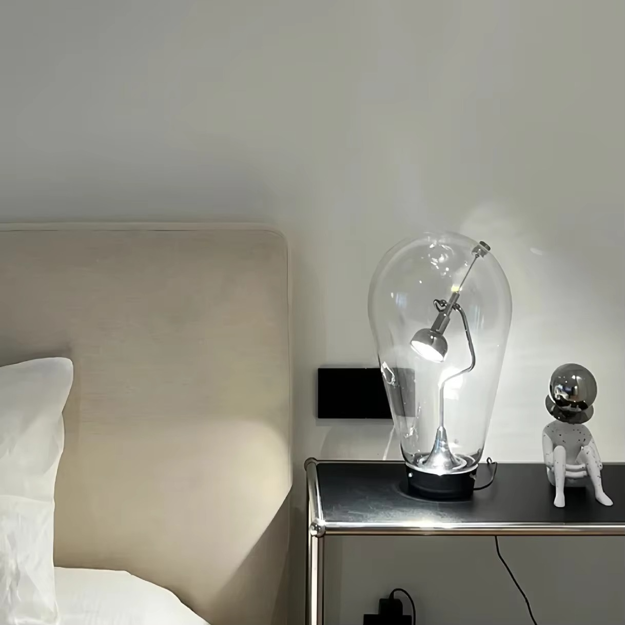 A lifestyle shot showing the lamp's ambient glow in a living room.