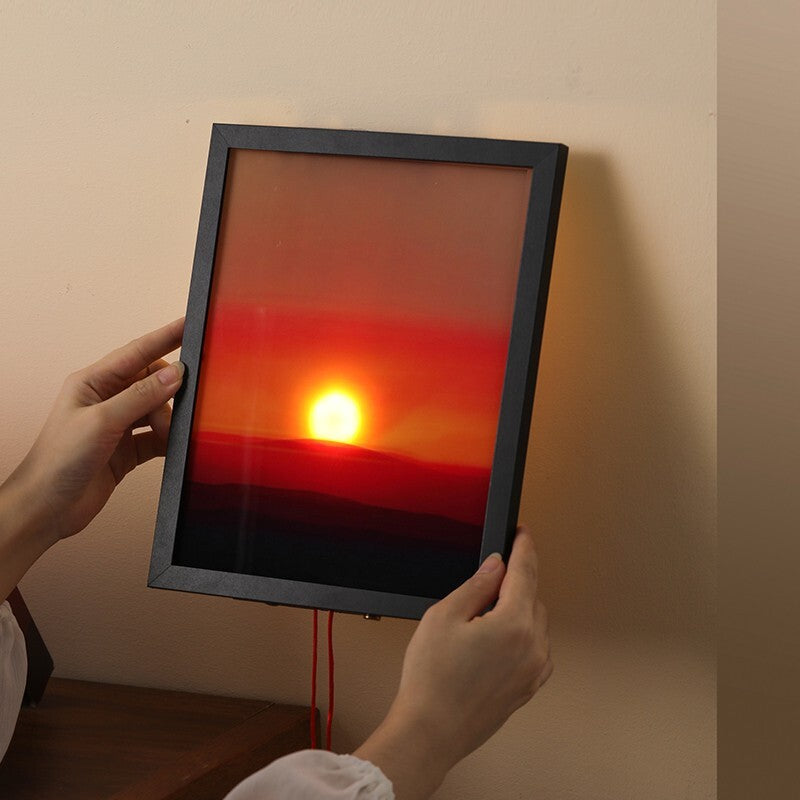 Sunset Time Ambient Art Wall Lamp creating a warm glow in a bedroom