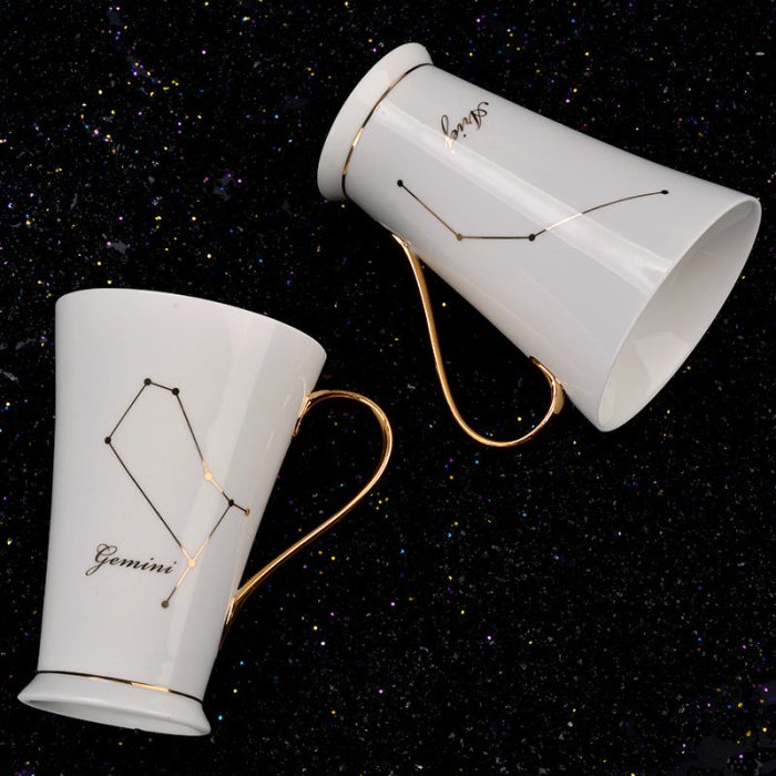 Ivory and Gilded Ceramic Coffee Cups Featuring Zodiac Symbols
