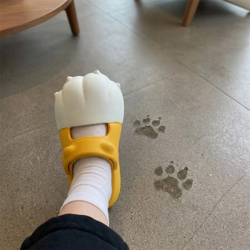 Woman wearing the playful cat paw slippers outdoors