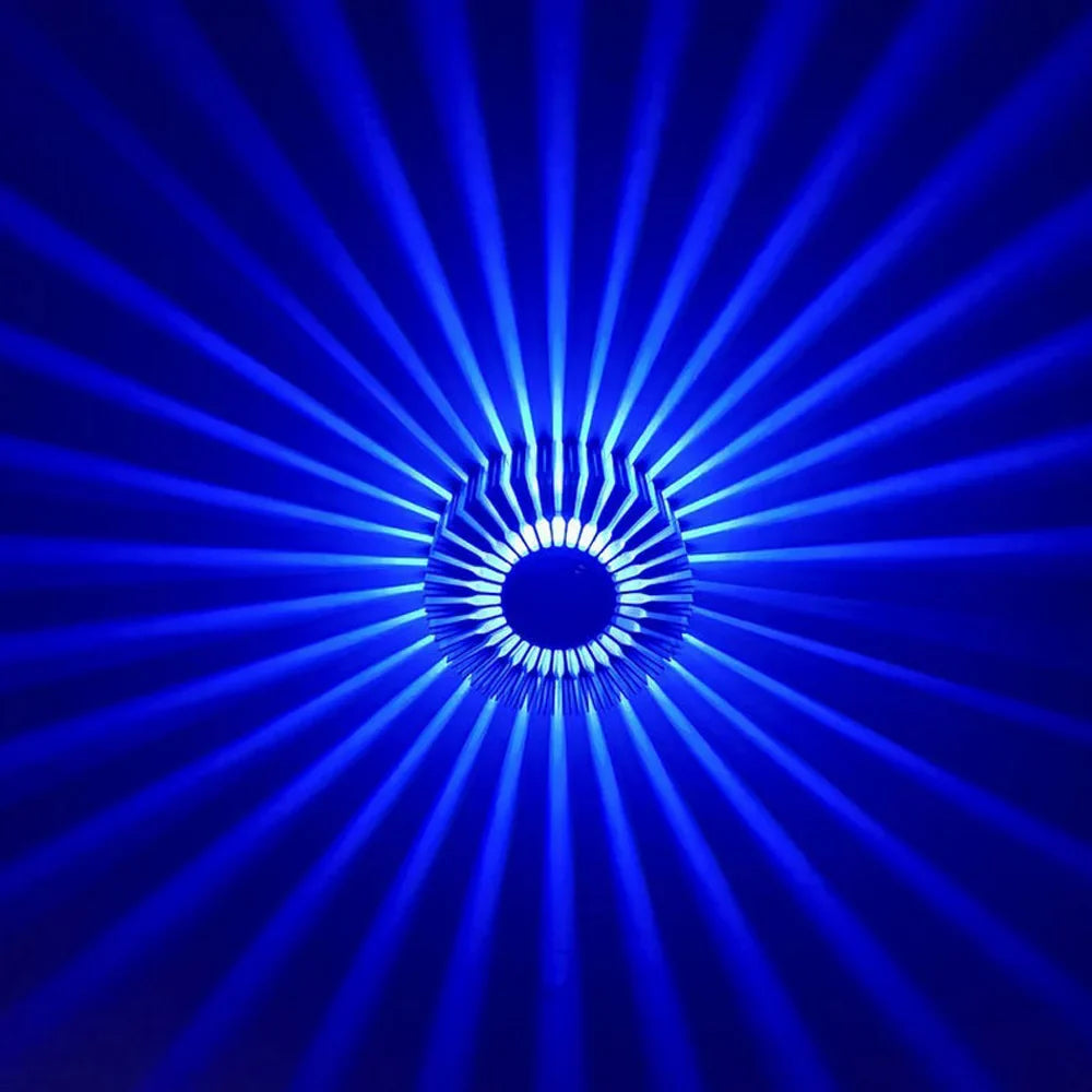 A single Sunburst Art LED Ceiling Light mounted on a wall casting a beautiful pattern