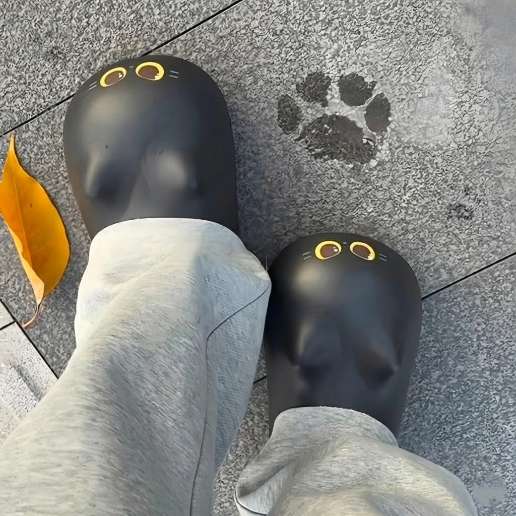 A person lounging comfortably wearing the Cute Cat Paw Slippers