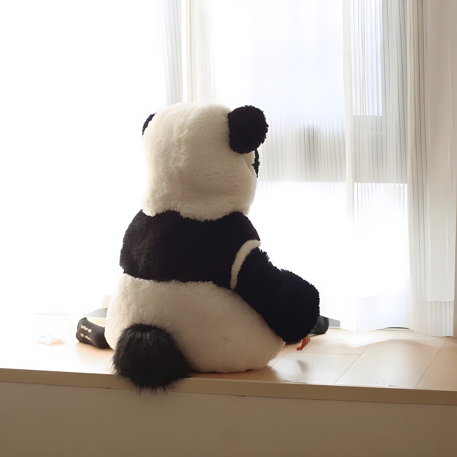 A closeup of the soft fabric on the panda onesie for kids