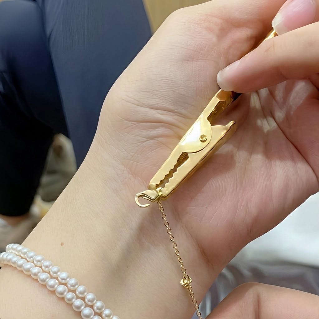 A person easily fastening a bracelet using the One Hand Bracelet Clasp Holder Jewelry Tool