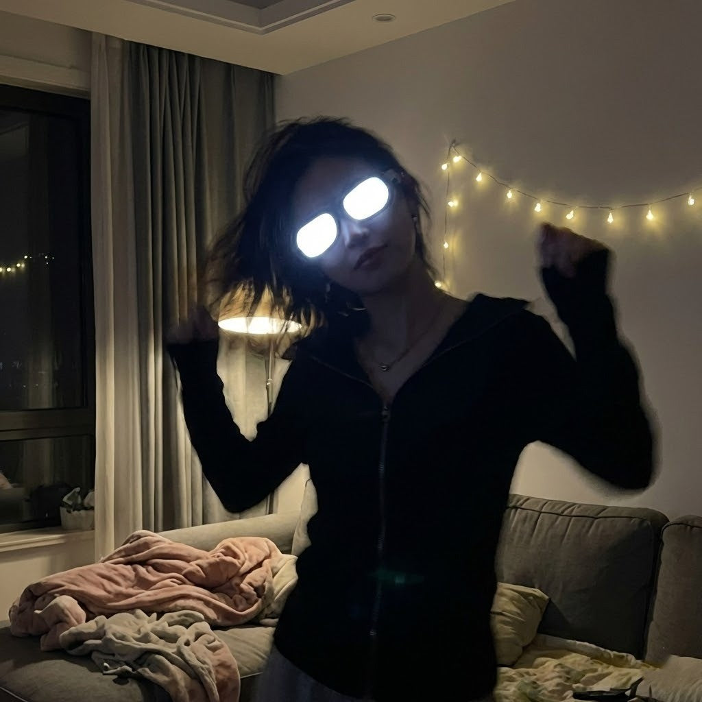 Friends having fun at a party wearing LED light-up glasses