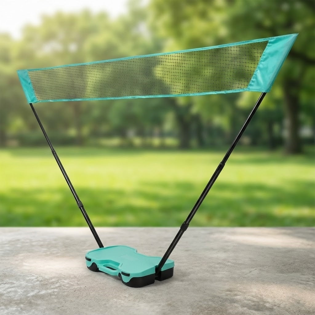 Friends enjoying a game of badminton with the portable set at the beach