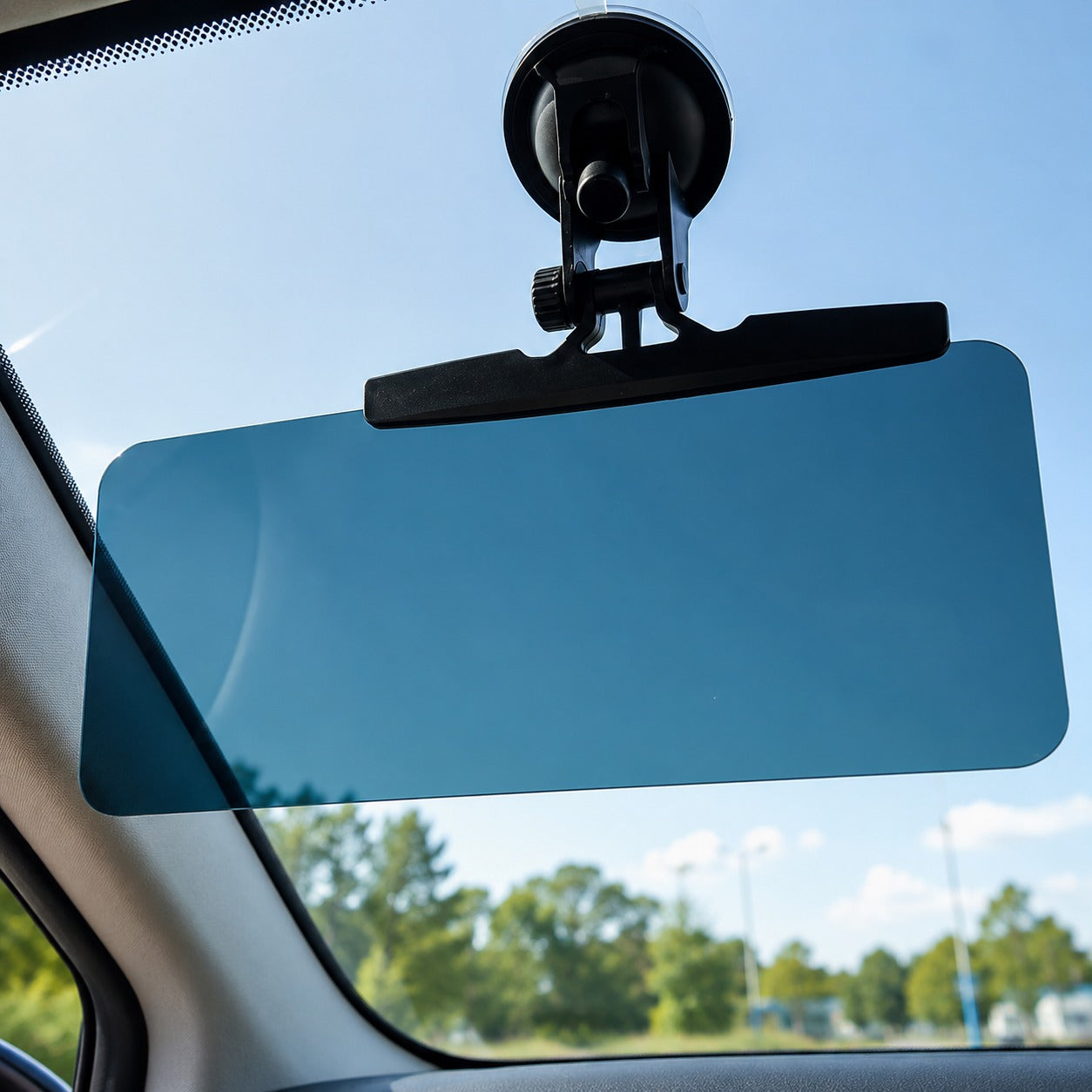 Adjustable sun visor extension panel blocking glare for a safer drive