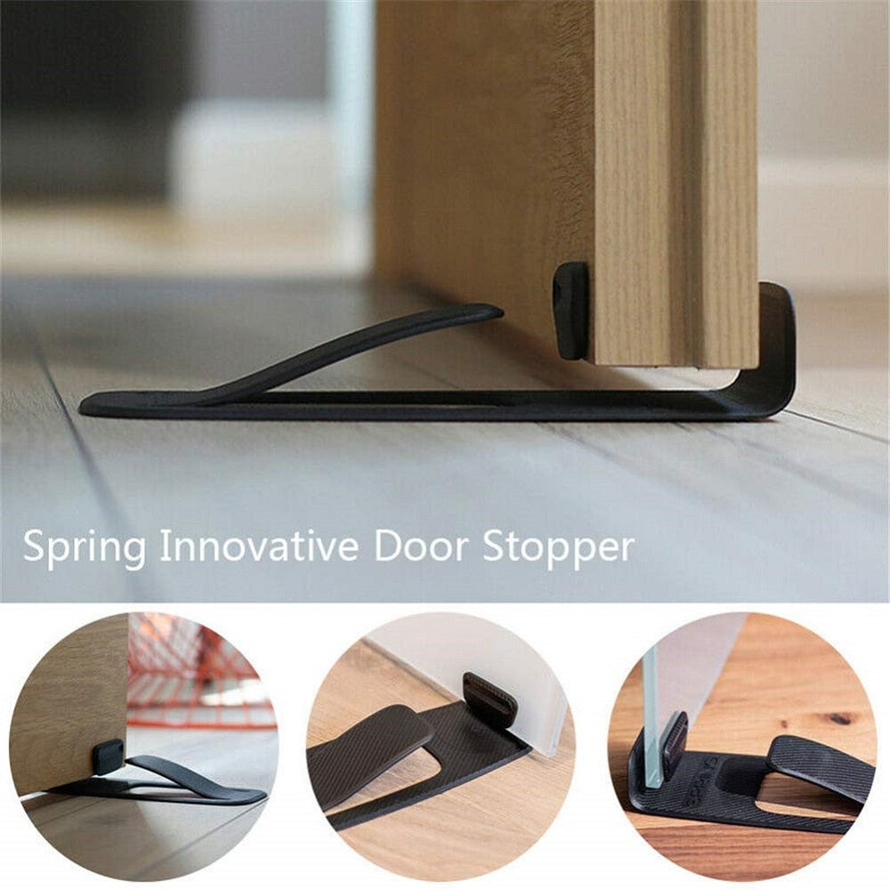 Close-up of the stylish matte black Creative Smart Door Stopper against a white door
