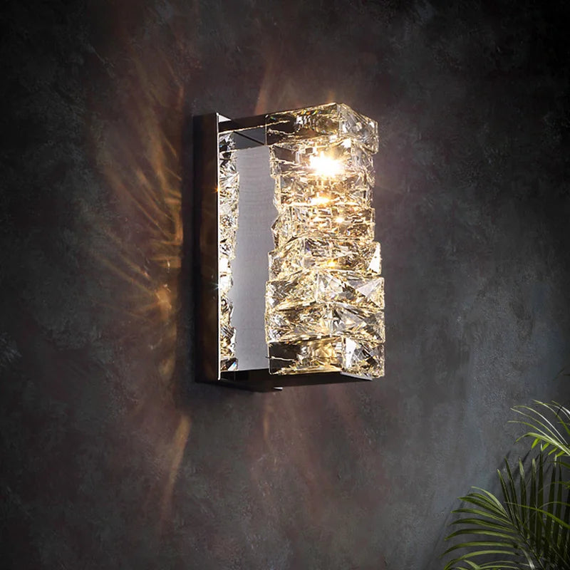 Detailed view of the layered crystal segments on the wall lamp