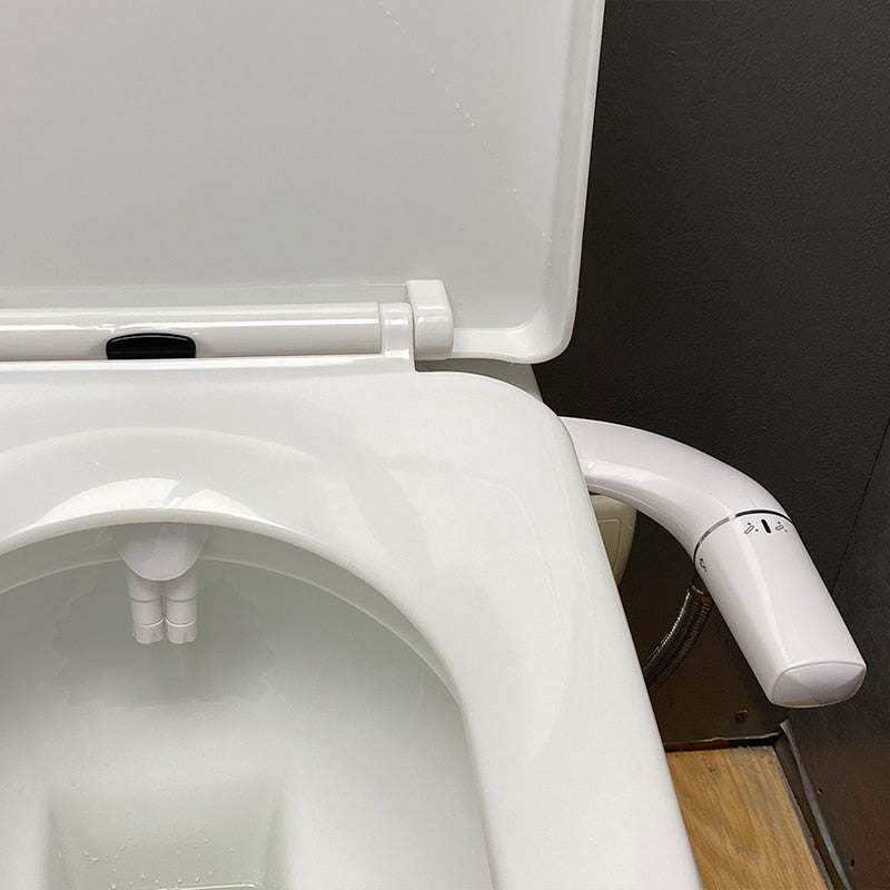 The Ultra Slim Sleeky Spray Bidet installed on a toilet, showcasing its slim profile.
