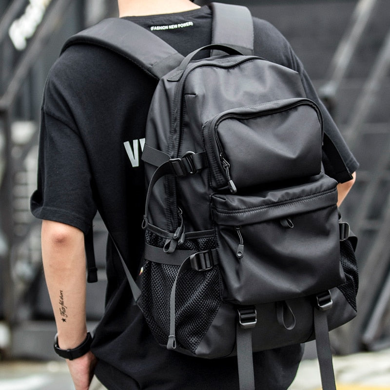 A person wearing the stylish urban travel backpack in black