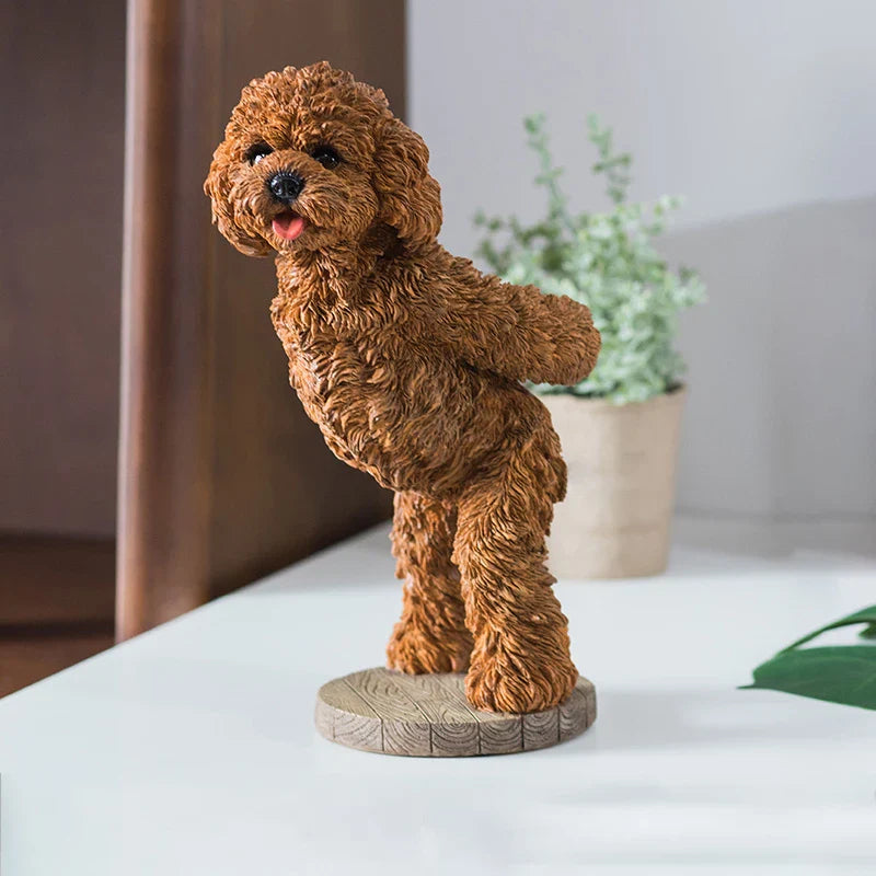 Full view of the resin puppy holding a standard red wine bottle securely.