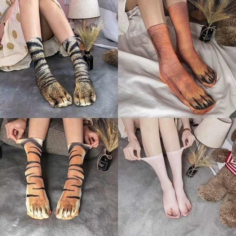 Collection of different animal paw socks including cat, dog, and tiger
