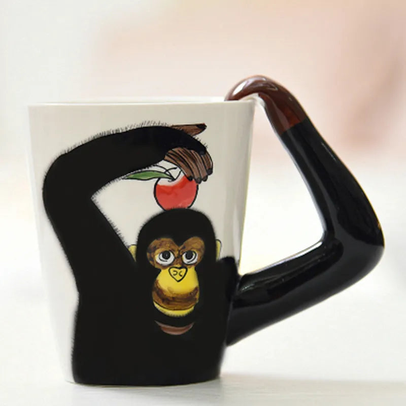 Holding the whimsical giraffe design Jungle Brew coffee mug