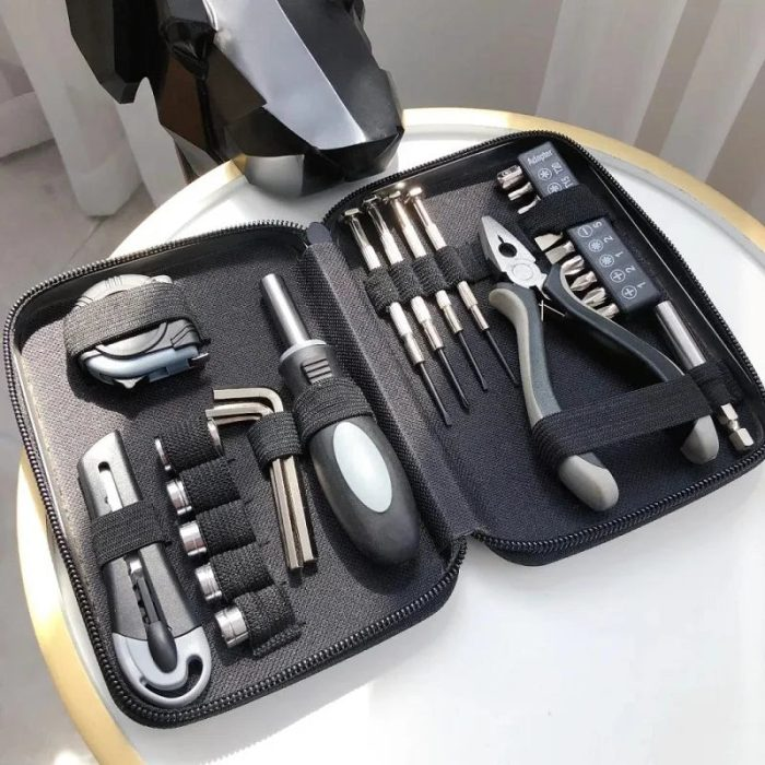 The 27in1 Armored All-in-One Repair Tool Set laid out, showing a wide variety of tools neatly organized in a rugged case.