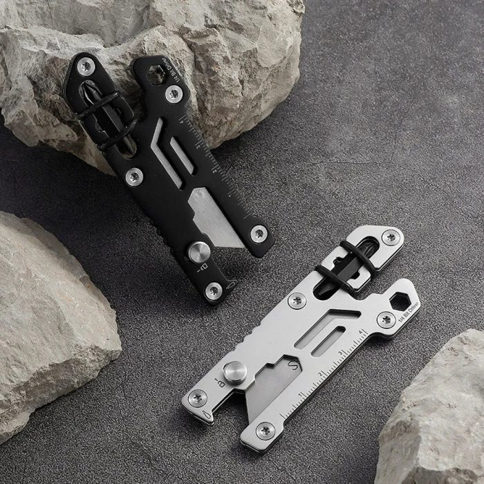 A small, compact EDC (Everyday Carry) retractable mini knife with a sharp blade, ideal for quick, precise cuts and portable tasks.