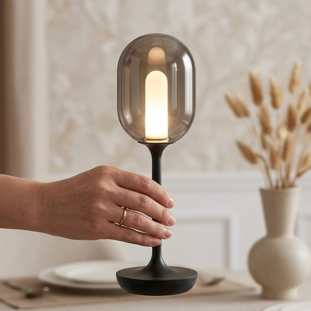 Close-up of the minimal oval glass design of the LED table lamp