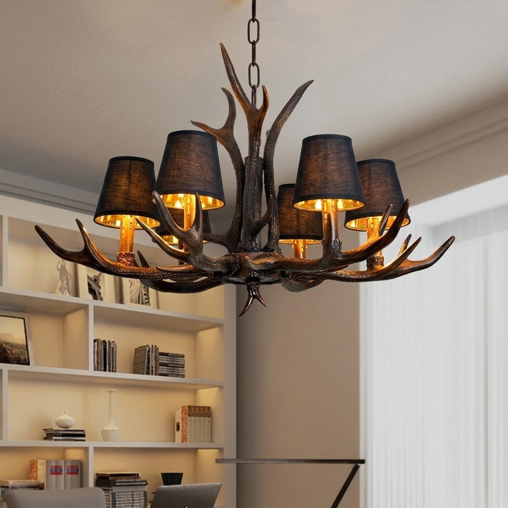 The warm glow from the rustic antler chandelier in a living room