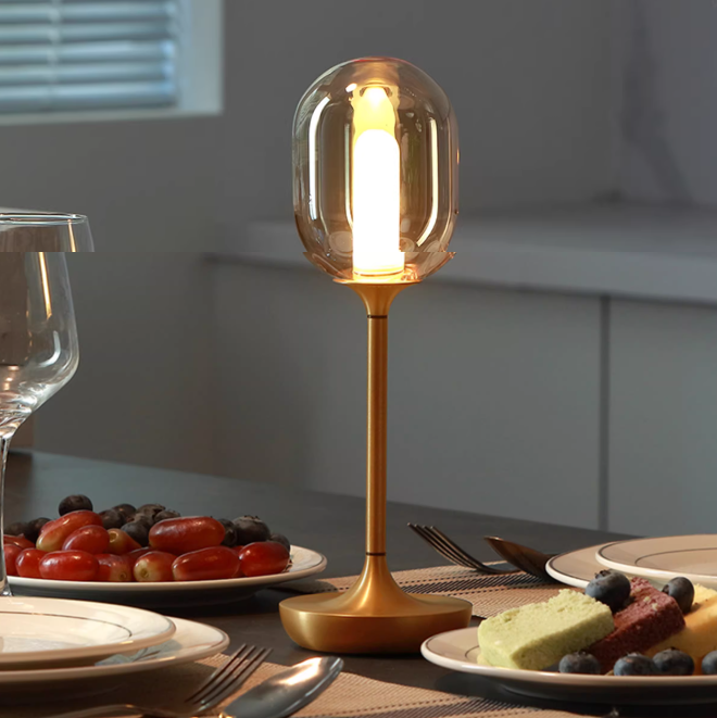 The Oval Glow lamp on a bedside table for a calming evening vibe