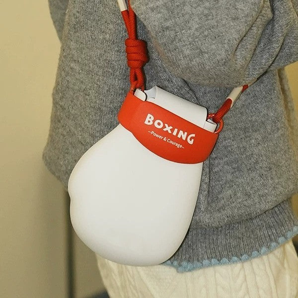 Close-up detail of the sporty boxing glove mini bag showing the synthetic leather material