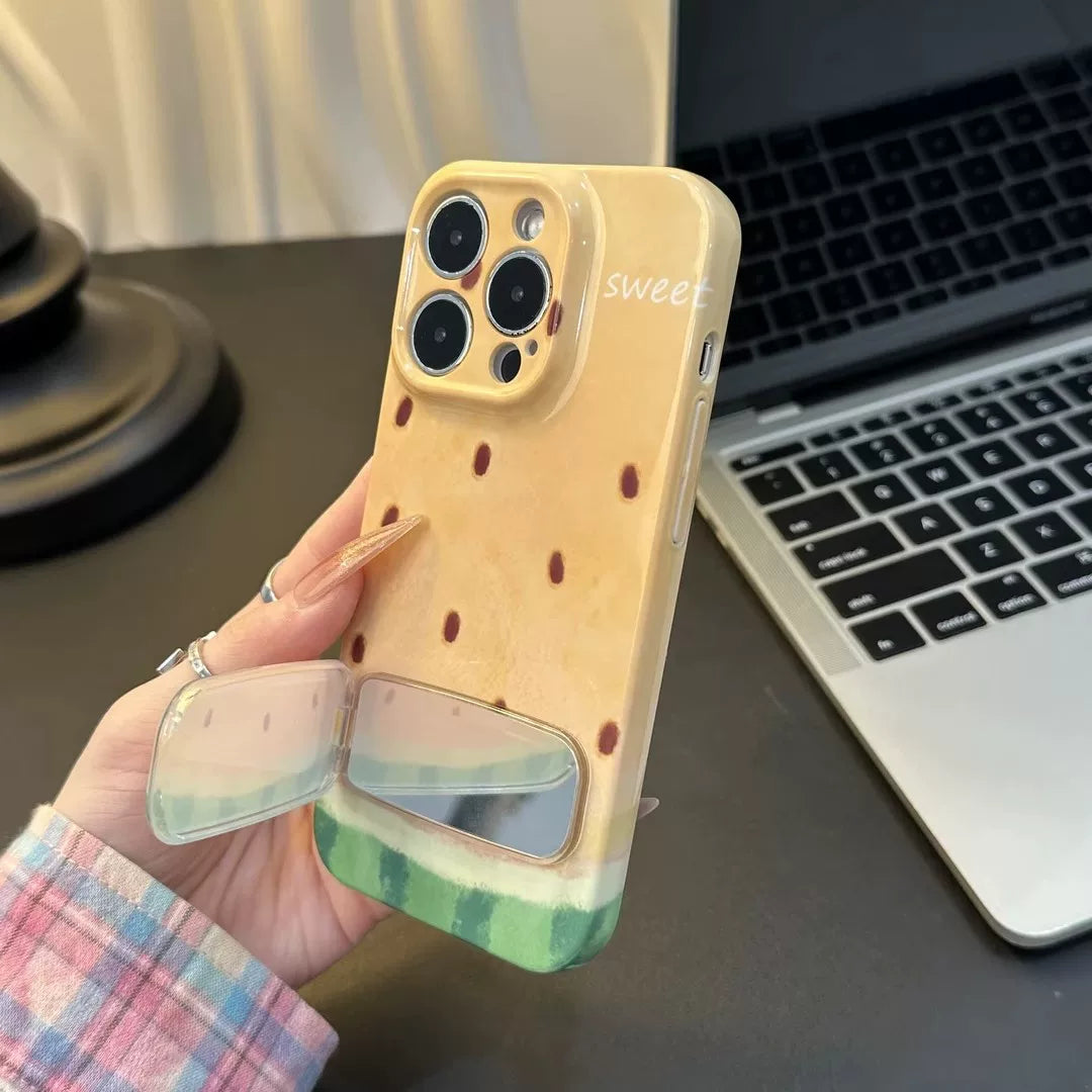 A person holding the Juicy Shell Mirror Watermelon iPhone Case