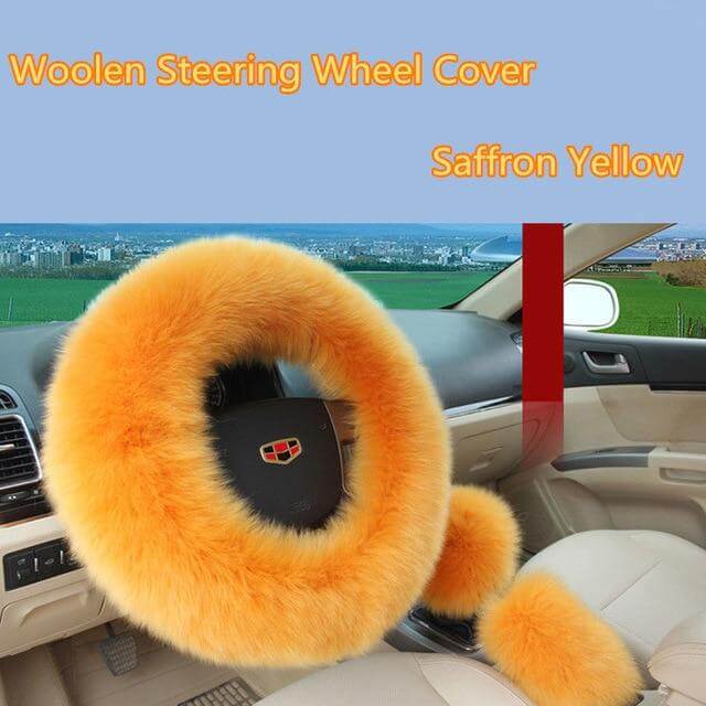 The plush warm steering wheel cover shown in a stylish pink color