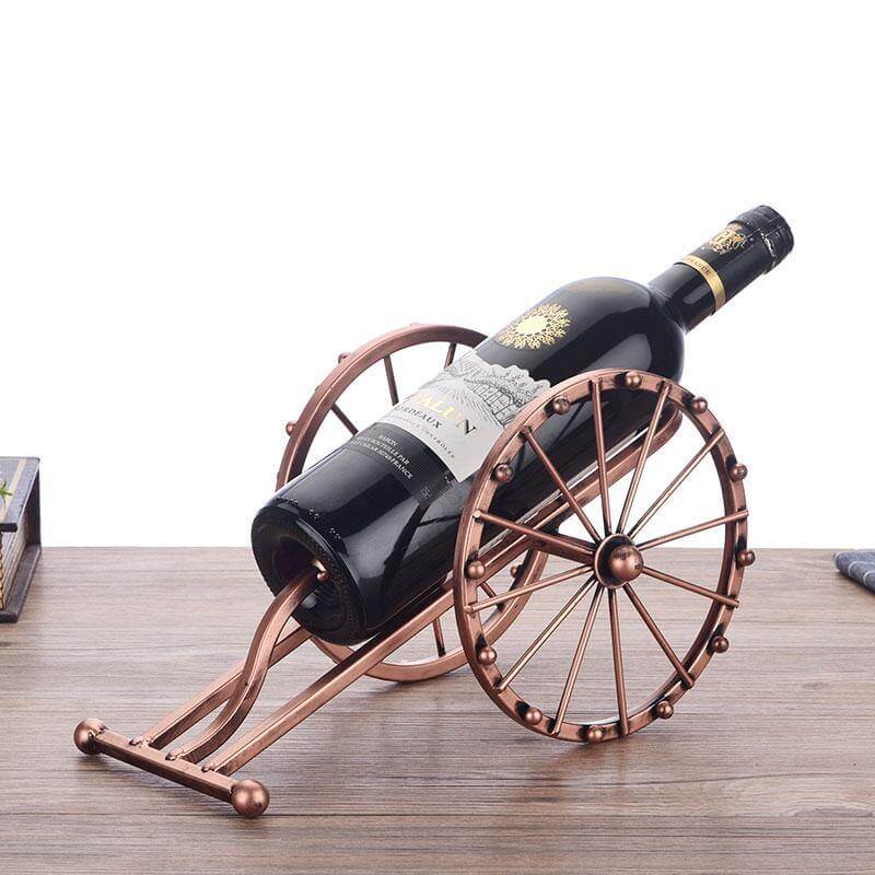 Antique Cannon Wine Bottle Holder showcasing a bottle of red wine