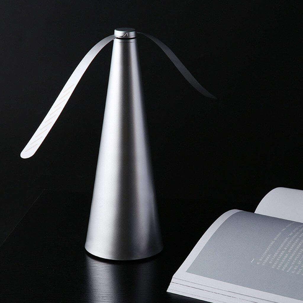Automatic Fly Trap fan spinning on an outdoor table keeping food safe